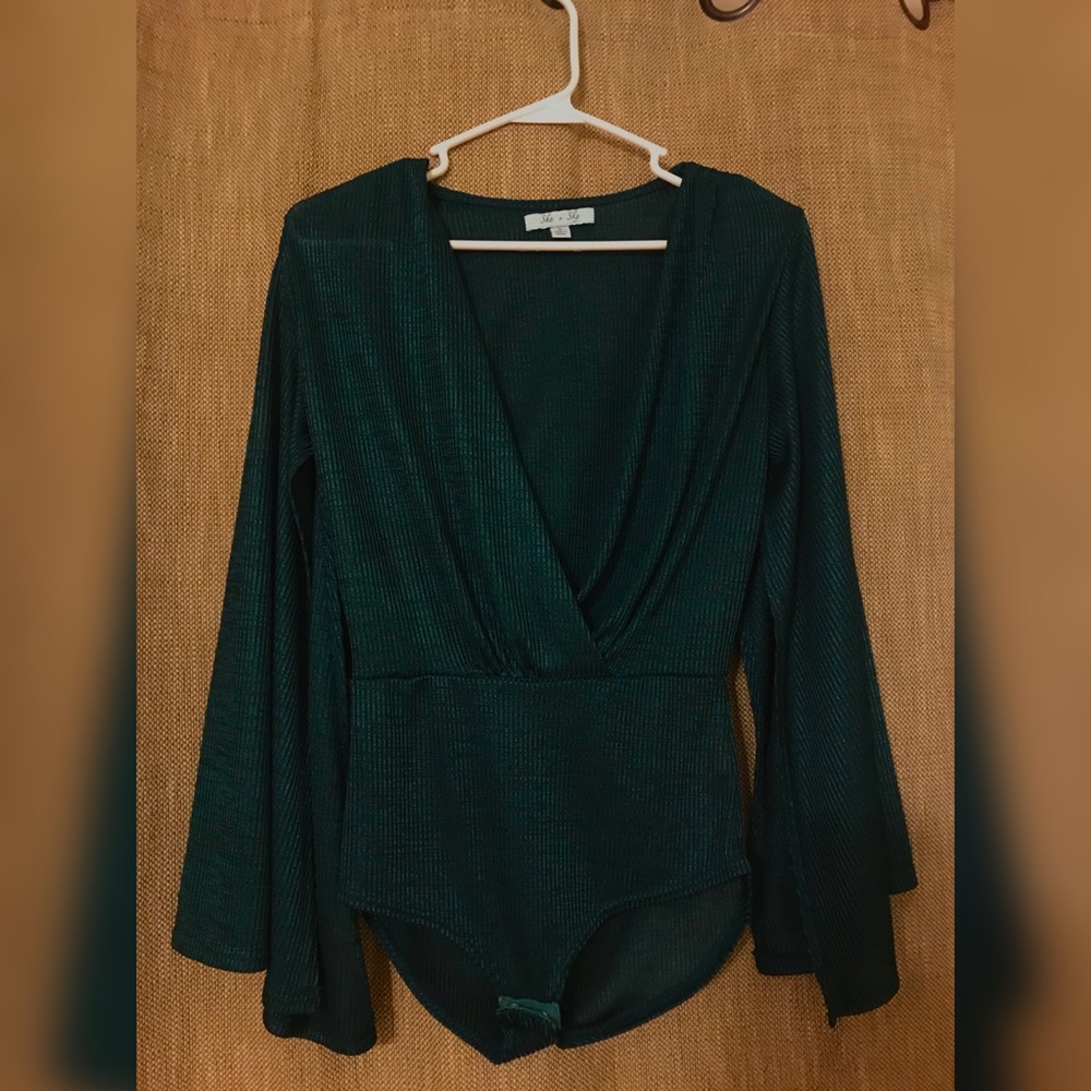 Emerald green blouse with shoulder pads